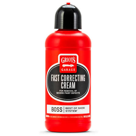 A red bottle of Griot's Garage Fast Correcting Cream with a black cap, shown on a plain white background.