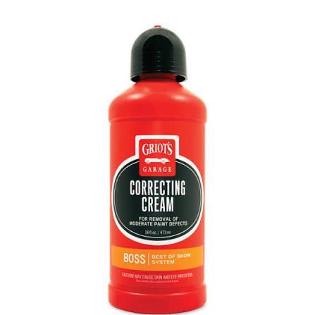 A bottle of Griot's Garage Correcting Cream for removal of moderate paint defects, featuring a bright red bottle, black cap, and a black and orange label.